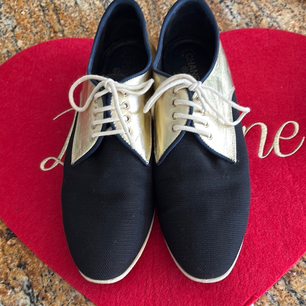 CHANEL Black and Gold Flats and Loafers with Elegant Design